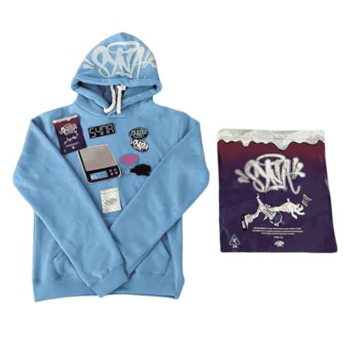 POLERON SYNA WORLD "Celeste"+ BOLSA y STICKERS